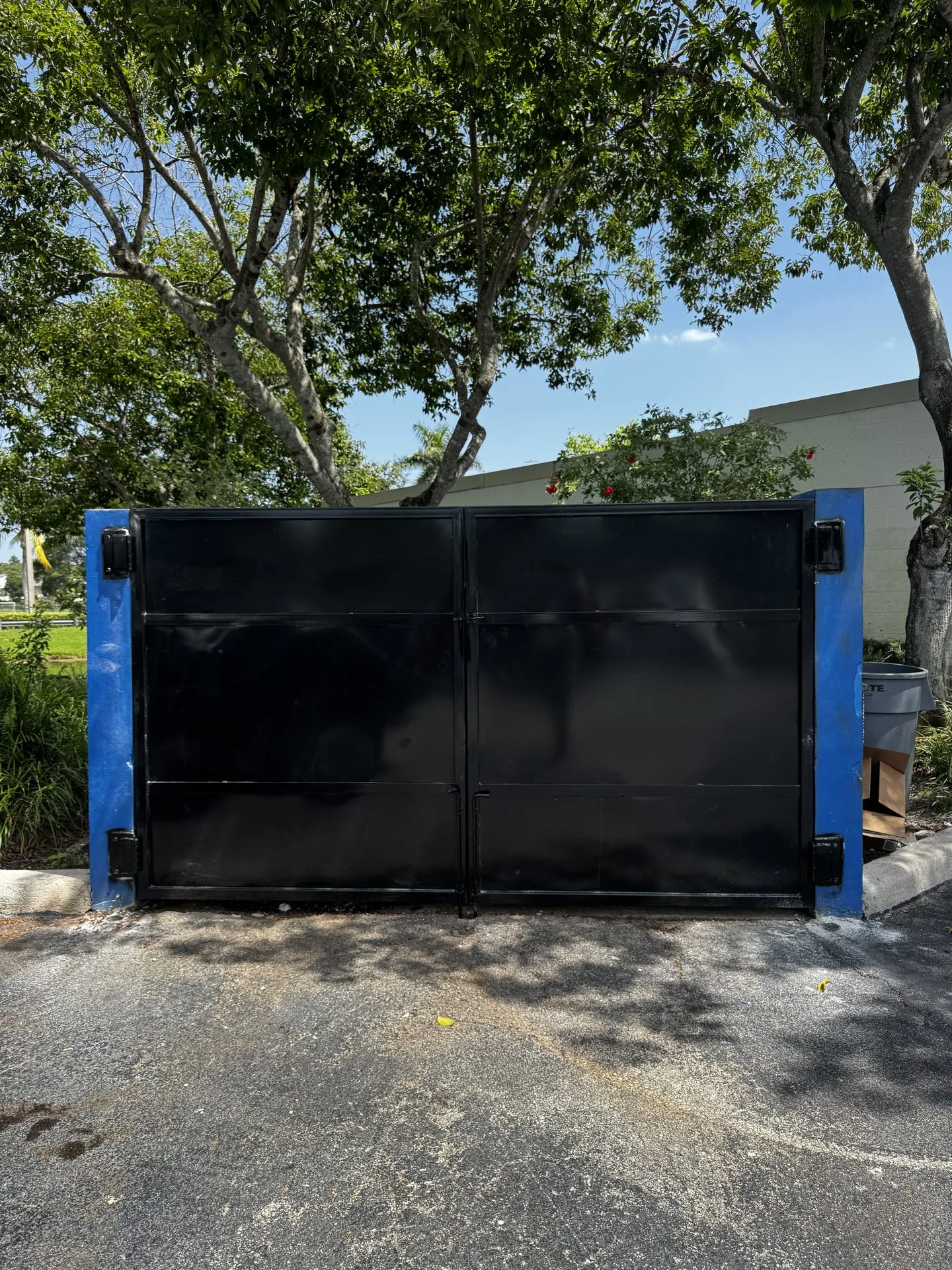 Finished steel dumpster enclosure with gates closed