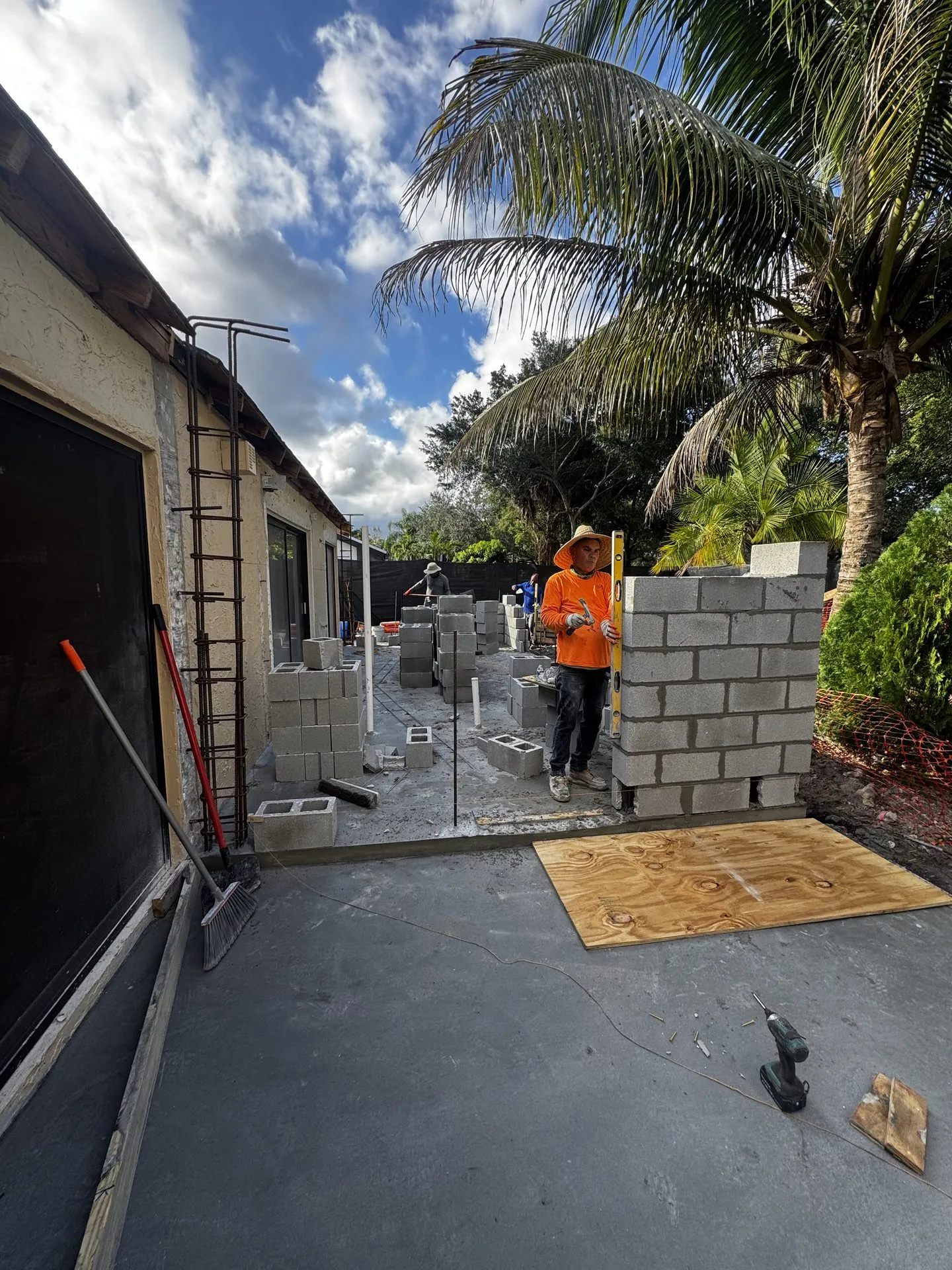Block wall and concrete slab preparation at a residential backyard project