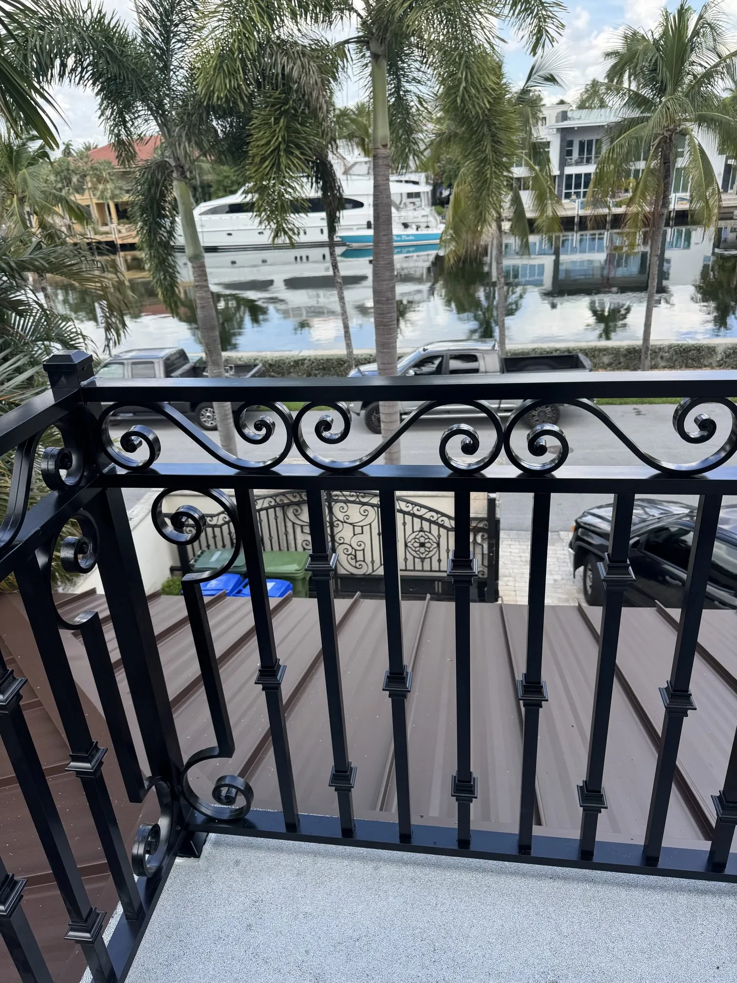 Ornamental iron railing on a waterfront balcony in Miami-Dade County