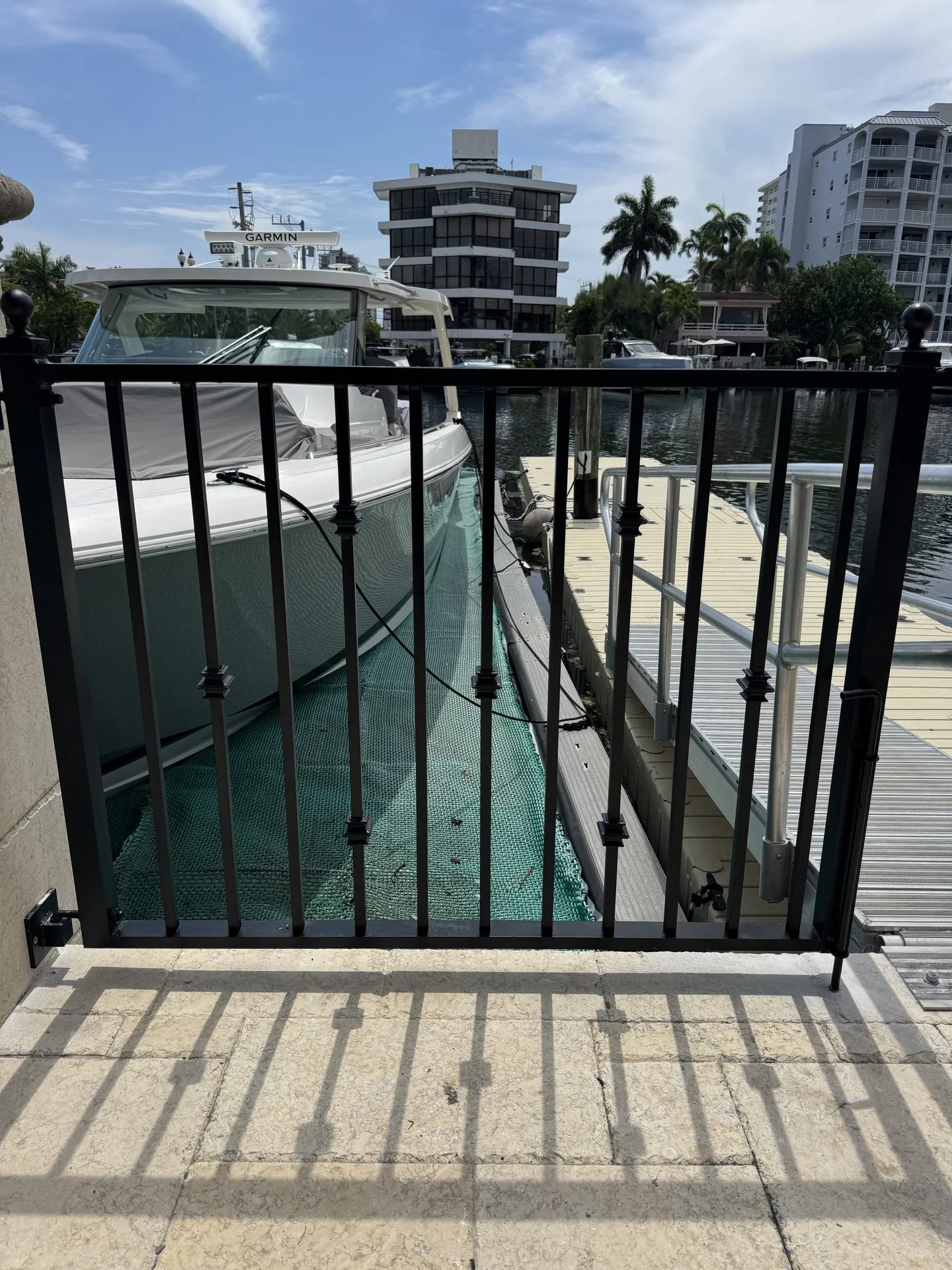 Custom iron dock gate overlooking a Miami waterway